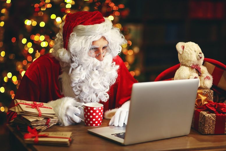 Santa Claus Reading Laptop