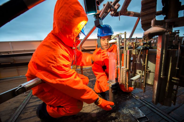 Scientists Retrieving Sediment Core