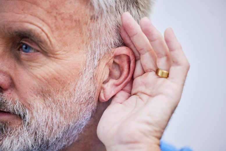Senior Man Listening Hand Cupping Ear