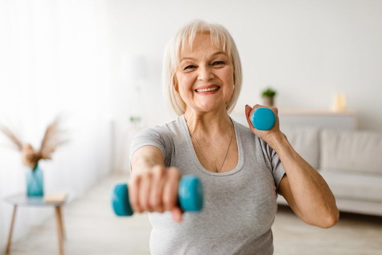 Senior Woman Exercising Home Dumbbells