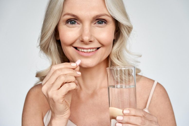 Senior Woman Taking Vitamin Pill
