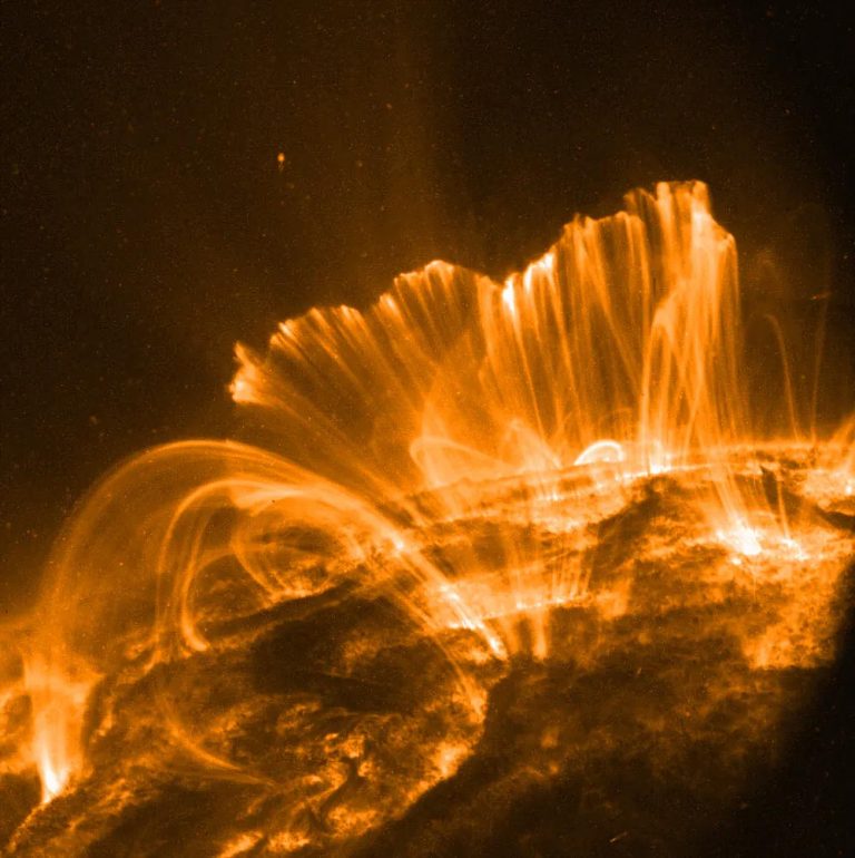solar flares travel at the speed of light