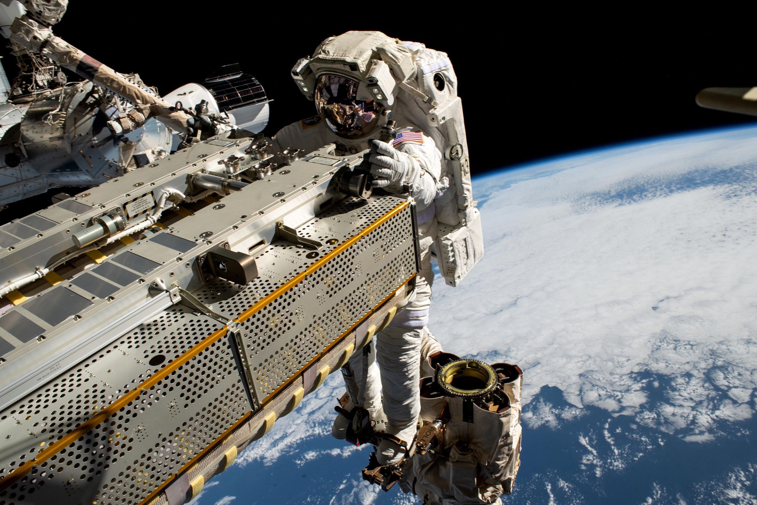 Astronauts finish installing a collapsible solar array on a record-setting spacewalk