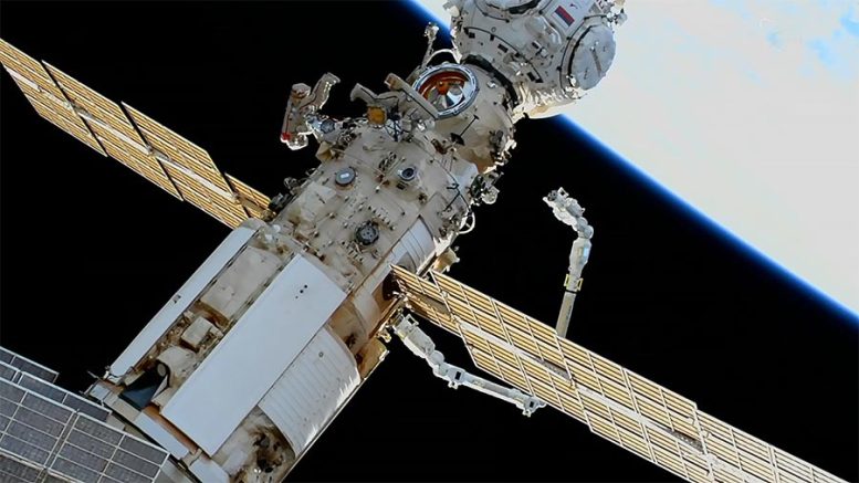 Spacewalkers Oleg Artemyev and Denis Matveev Robotic Arm