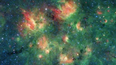 Starry Region Bursting With Bubbles and Bow Shocks Spotted by Spitzer