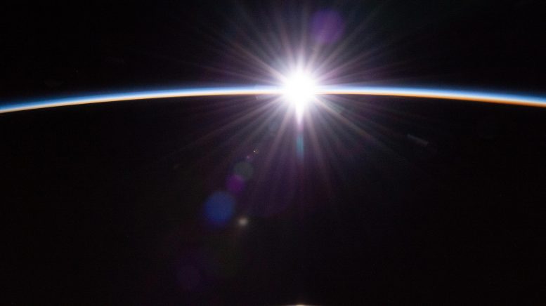 Sun's First Rays Burst Through Earth's Atmosphere