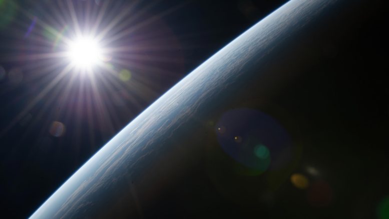 Sun’s Rays Burst Above Earth’s Horizon