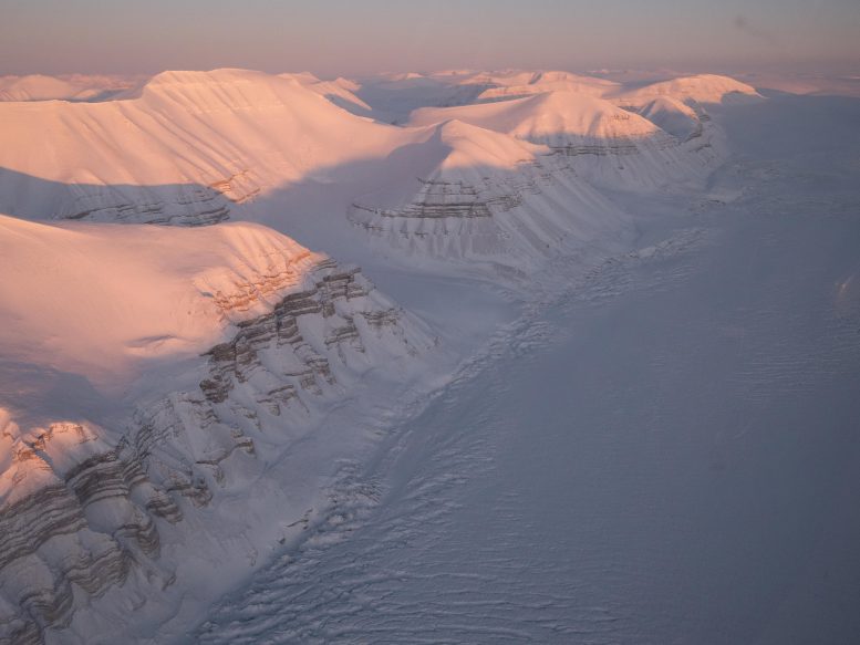 Svalbard&rsquo;s Snow Covered Mountains at Dusk