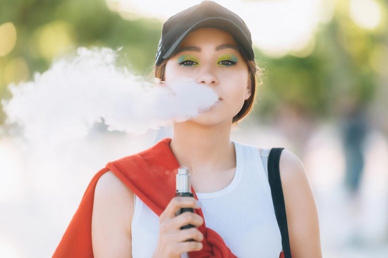 Teen Vaping E-Cigarette