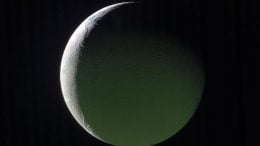 The Brightly Lit Limb of a Crescent Enceladus