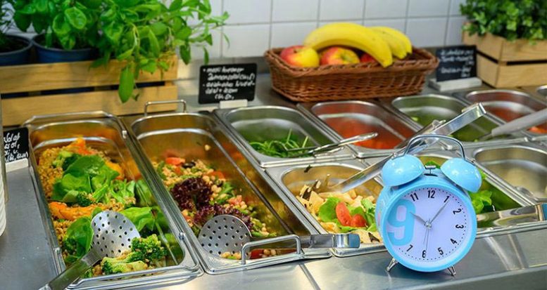 Timing and Food Choices Displayed at a Buffet Counter