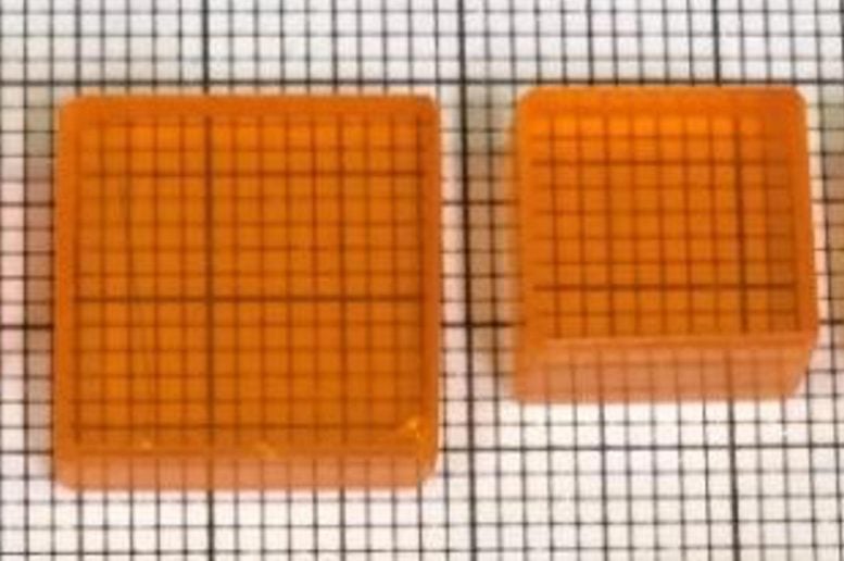 Two Orange Perovskite Crystal Blocks on Grid