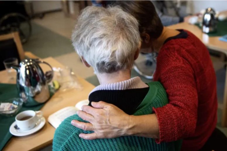 Two People Seated Together in a Care Setting