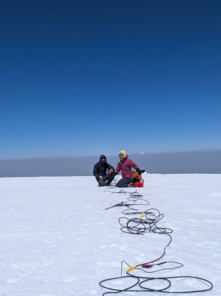 Two Scientist Lay Out Sensors for Seismic Measurement on Mount Arara