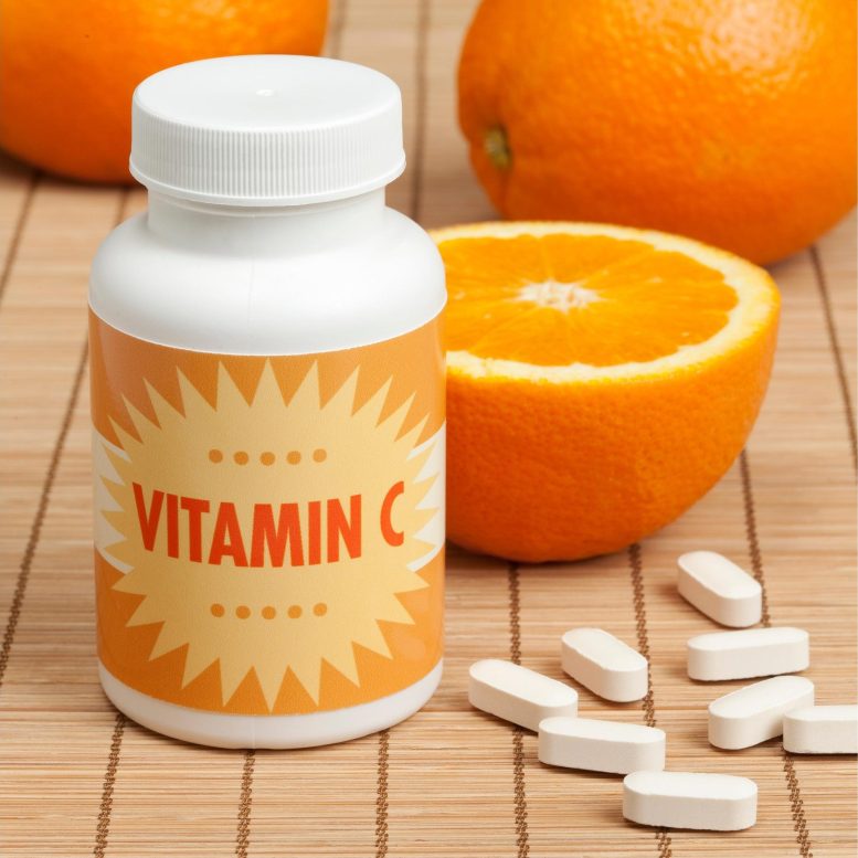 Vitamin C Tablets and Oranges