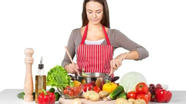 Woman Cooking Vegetables