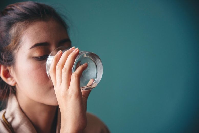 Woman Drinking Water Glass