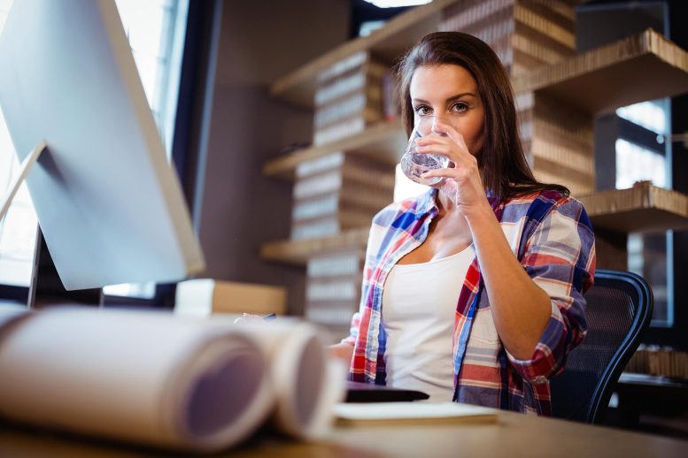 Woman Drinking Water Office Desk