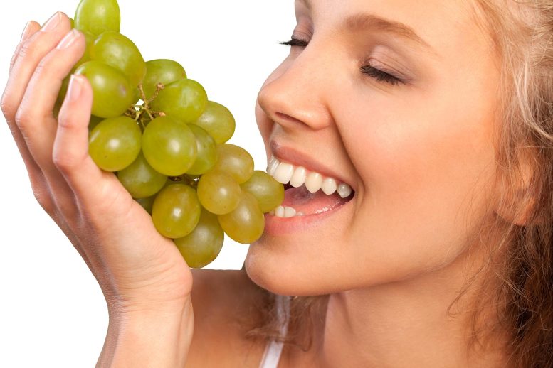 Woman Eating Grapes