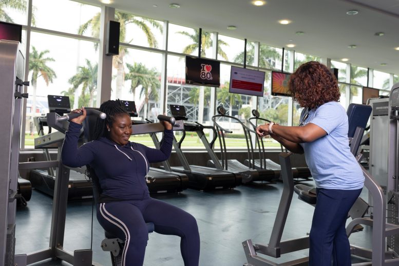 Woman Exercising on Gym Machine