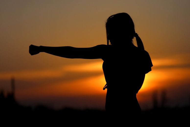 Woman Punching Running Sunset