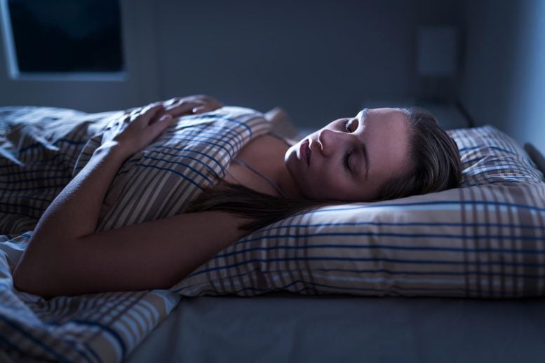 Woman Sleeping Peacefully Dark Bedroom