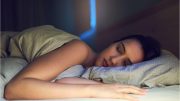 Woman Sleeping in Bed at Night