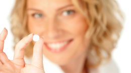 Woman Taking White Pill Medicine