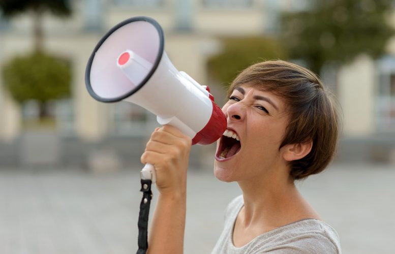 Woman Yelling Into Megaphone