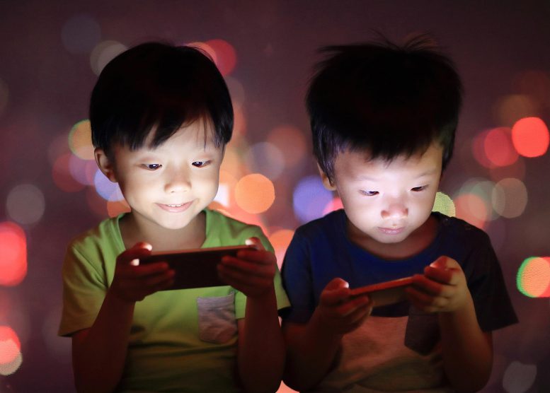 Young Boys Using Smartphones