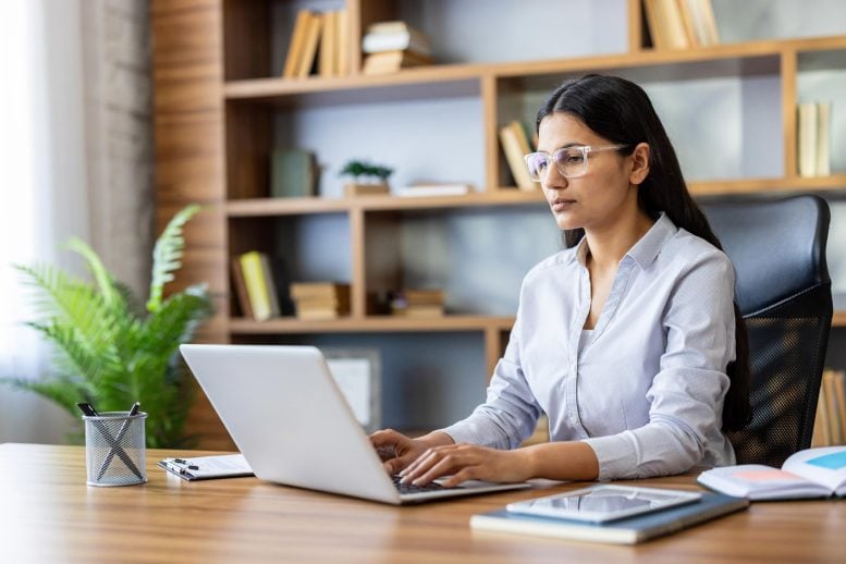 Young Businesswoman Sitting Desk