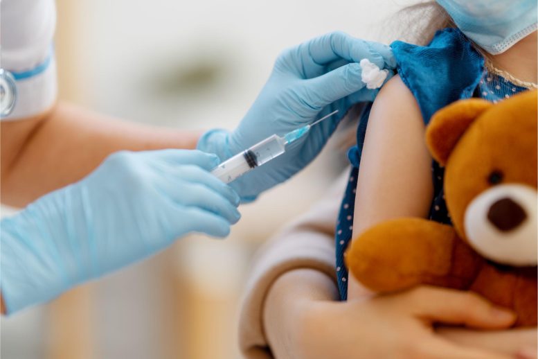 Young Child Holding Stuffed Animal Vaccine Shot