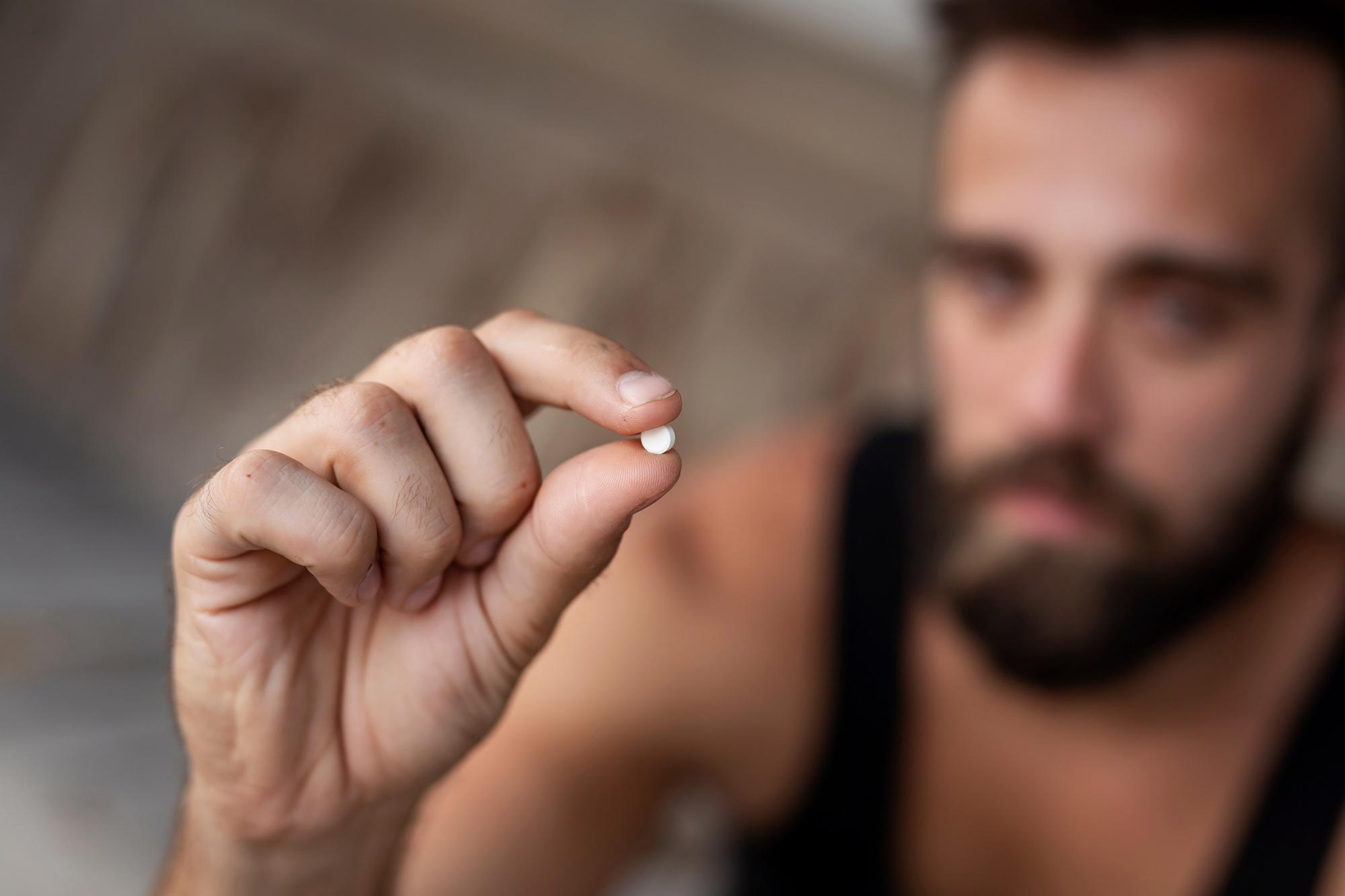 Young Man Hold Pill Drug