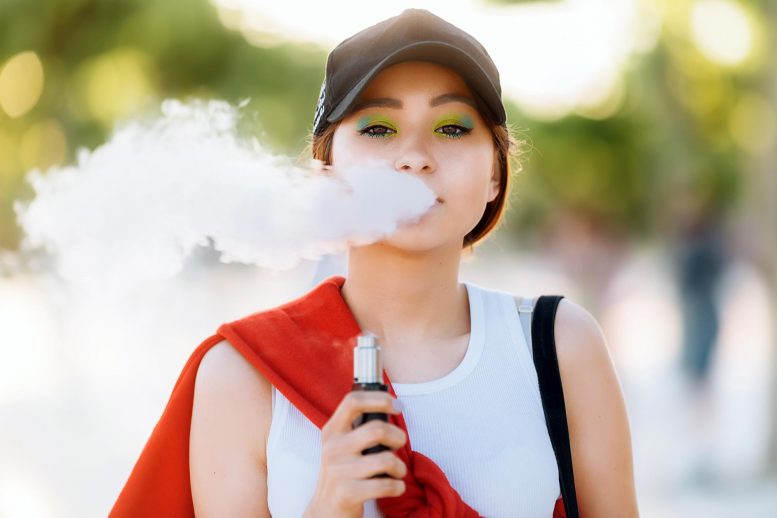 Young Person Vaping E-Cigarette