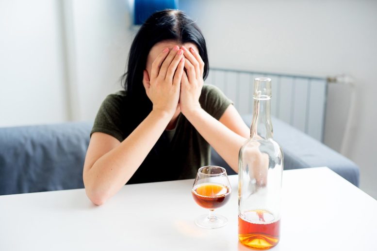 Young Woman Alcoholic Drinking Alone