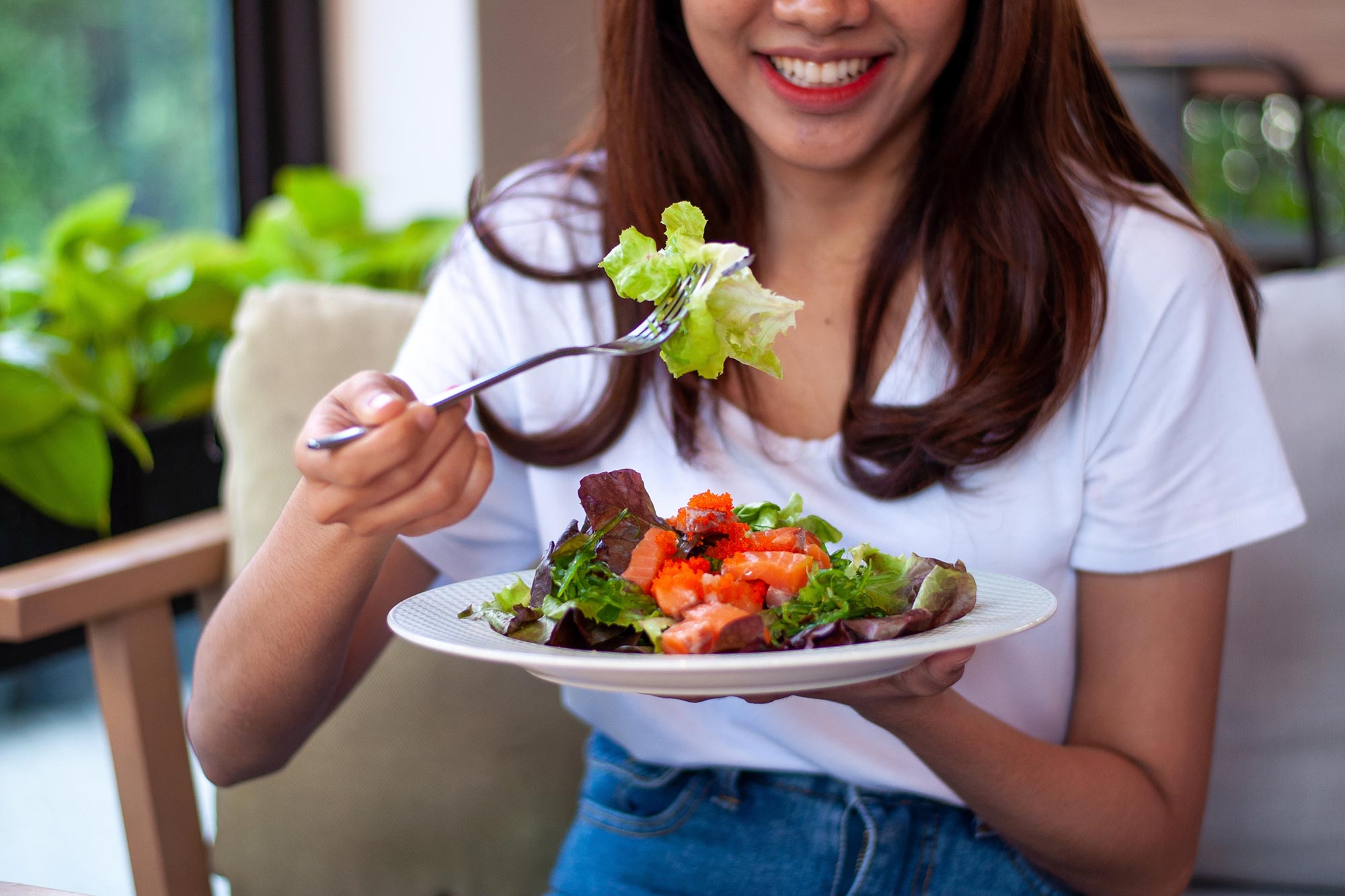 Young-Woman-Eating-Salad.jpg