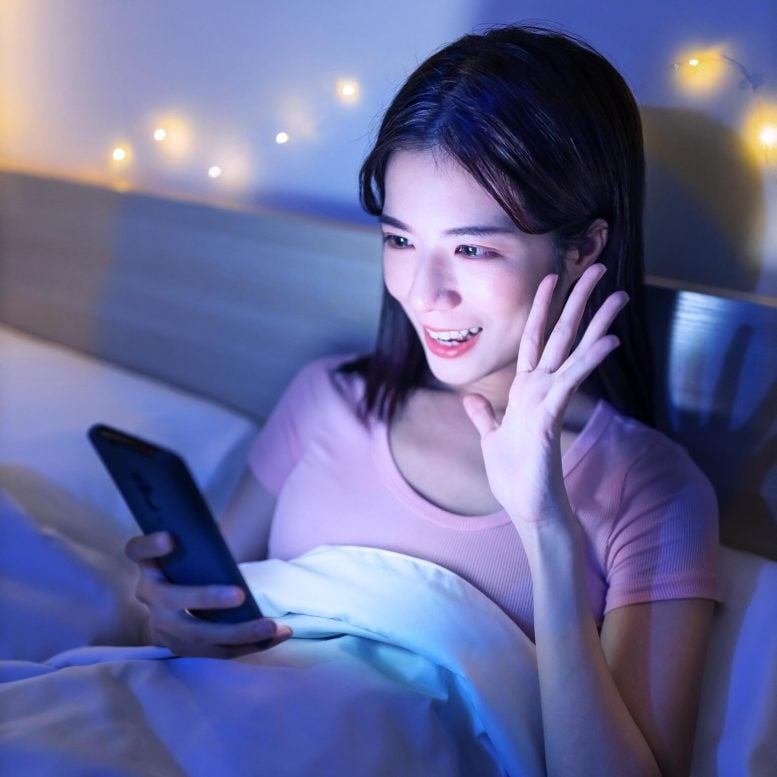 Young Woman Smartphone Glow Bed