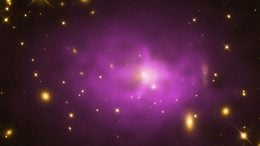 A galaxy cluster about 1.3 billion light years from Earth with a large elliptical galaxy in its center.