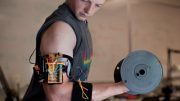 electronic trainer gives bulging biceps