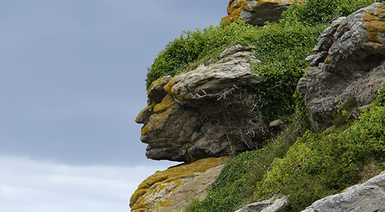 Rock formation resembling a human face in Ebihens, France